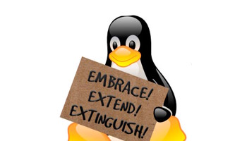 the linux mascot holding a placard sign