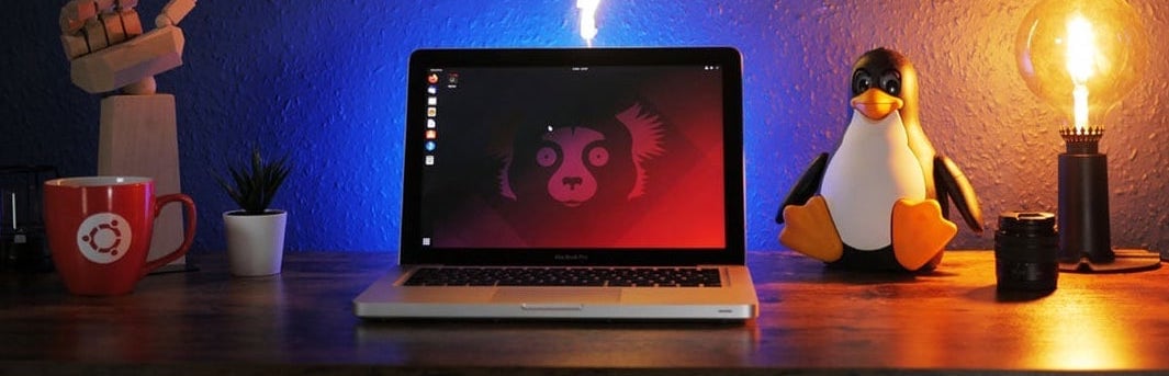 a photo of a laptop on a desk running ubuntu 21.10
