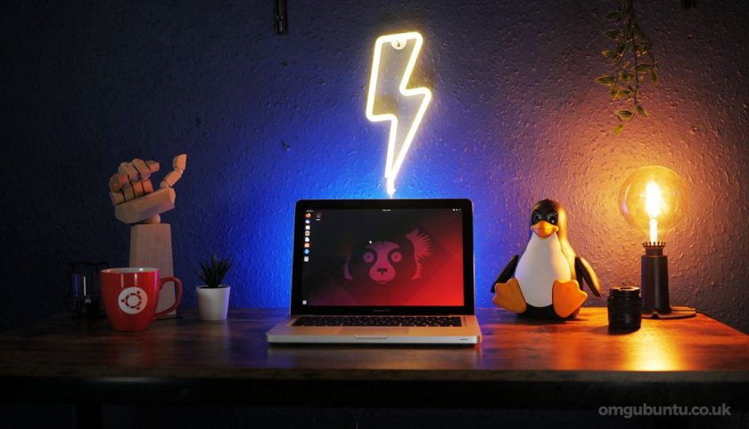 a photograph of a laptop on a desk running ubuntu